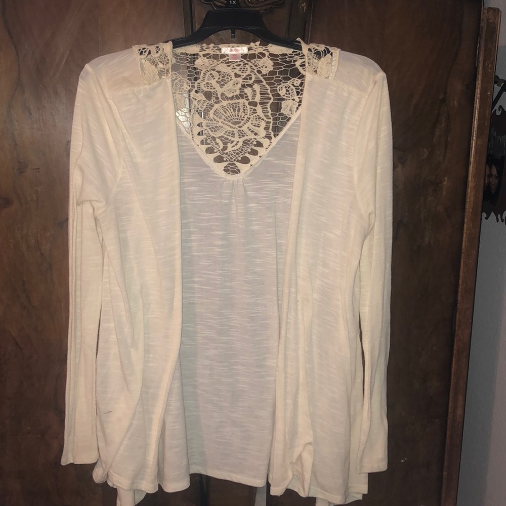 Beautiful soft white cardigan with a pop of lace!